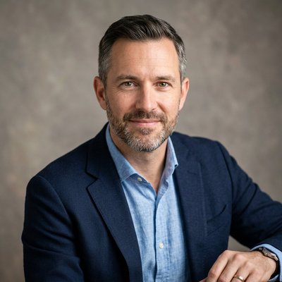 David Emerson, satchmonyc principal analyst, photographed against a warm neutral studio background